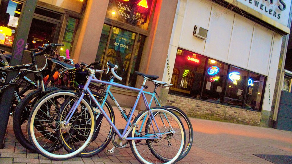 Bikers making do without useful bike racks.