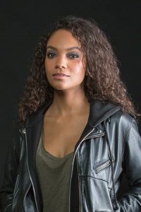 Lyndie Greenwood as "Nola Barnes"